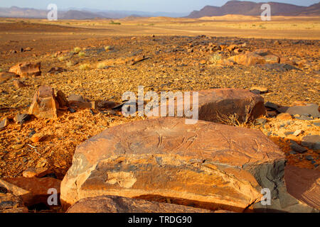 prehistoric petroglyphs in desert landscape, Morocco, Alnif Stock Photo
