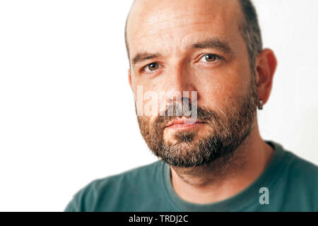 bearded sympathetic man in front of white background, Germany Stock Photo