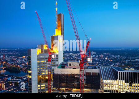 construction site in the financial district next to Commerzbank tower block and Taunus Tower in evening light, Germany, Hesse, Frankfurt am Main Stock Photo