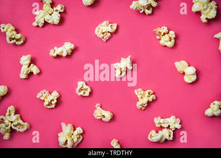 Popcorn pattern on red background on top view / Sweet butter popcorn Stock Photo