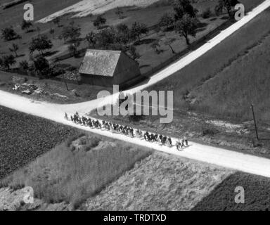 wedding in rural region,  walk to the church, aerial photo in the year 1960, Germany, Bavaria, Swabia, Merzingen Stock Photo