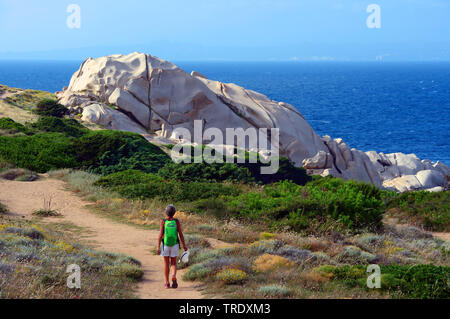 Woman walking in Capo Testa, Italy, Sardegna, Santa Teresa Gallura Stock Photo