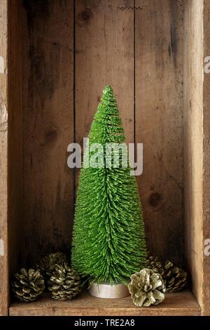 wooden box with Christmas tree and golden pine cones, christmas decoration Stock Photo