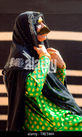 woman with traditional mask, the burqa, United Arab Emirates, Dubai ...