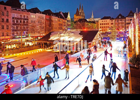 ice skating on the Heumarkt in the evening, Germany, North Rhine-Westphalia, Cologne Stock Photo