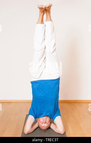 man doing yoga, Europe Stock Photo