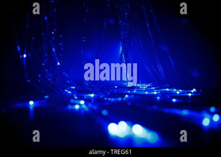 3D computer graphic, fieber optic cables light up in blue color - light arts Stock Photo