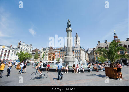 Lille (northern France): real estate in the heart of the city centre with people sitting by a fountain and buildings with typical facades, Flemish arc Stock Photo