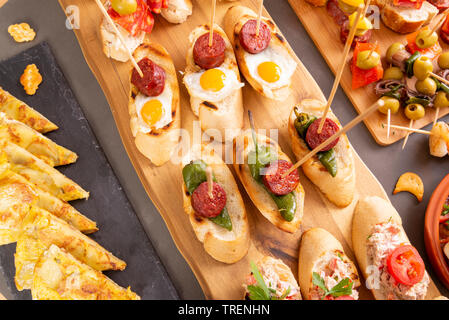 Top view of a variety of snacks - spanish tapas or italian antipasti. Flat lay Stock Photo