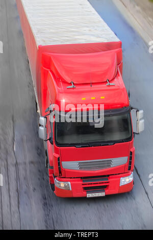 big powerful truck moves on highway Stock Photo