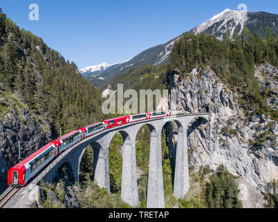Bernina Express on Landwasser viaduct. Swiss Alps, Unesco World Heritage Stock Photo