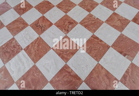 red and white tiles medieval floor background Stock Photo