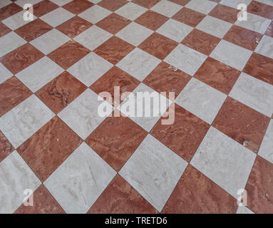 red and white tiles medieval floor background Stock Photo