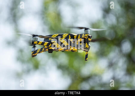 Drone quadcopter on nature background with a copy space. Top view, flat lay composition Stock Photo