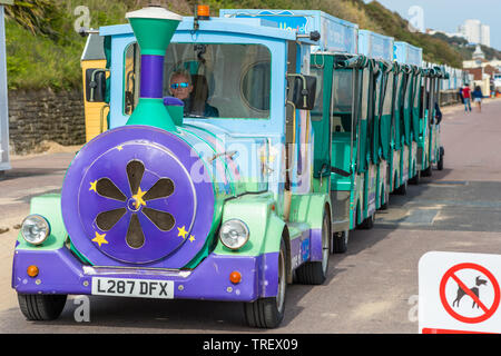 A Land train takes people for rides along the seafront promenade at Bournemouth, Dorset, England, UK Stock Photo