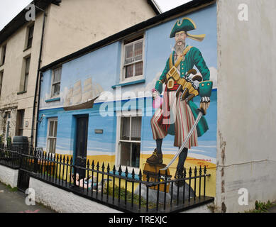 A mural painted on the side of a house in Borth's high street depicting a nautical theme Stock Photo