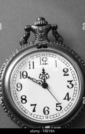 black and white photo of  open pocket watch, from above Stock Photo