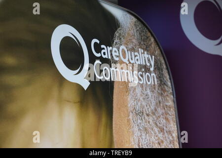 Care Quality Commission Sign at the Royal College of Nursing Annual Conference 2019 Stock Photo