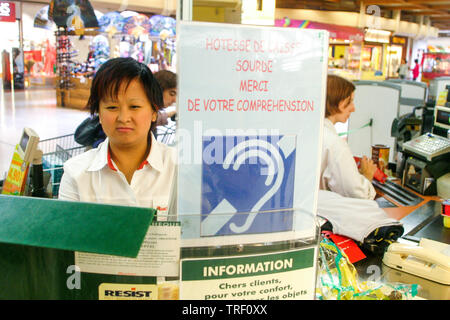 Auchan Hypermarket, disabled employee, Ecully, France Stock Photo