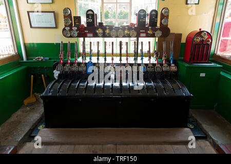 Leavers on the mechanical lever frame inside the signal box at Haven Street station on the Isle of Wight steam Railway. UK. (99) Stock Photo