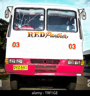 Puerto Princesa City, Palawan, Philippines: Front view of an old overland bus waiting for passengers at the bus terminal Stock Photo