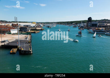 View of the River Medina looking towards Cowes on the Isle of Wight from a departing ferry. The Medina flows into the Solent / the sea. East Cowes is on the left of the picture and (West) Cowes is on the right. UK (99) Stock Photo