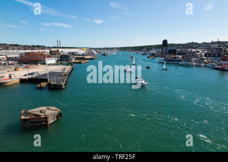 View of the River Medina looking towards Cowes on the Isle of Wight from a departing ferry. The Medina flows into the Solent / the sea. East Cowes is on the left of the picture and (West) Cowes is on the right. UK (99) Stock Photo