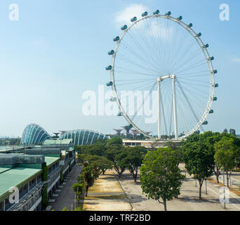 Singapore Flyer Ferris Wheel and motorsport Grand Prix GP pit stop facilities at Marina Bay Singapore. Stock Photo