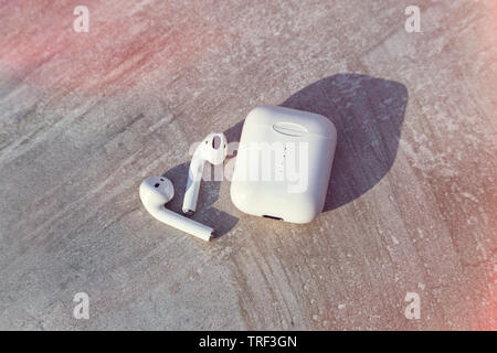 White Wireless Earphone with Case Top View Close Up Capture Stock Photo