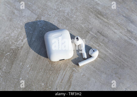 White Wireless Earphone with Case Top View Close Up Capture Stock Photo