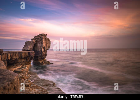 Sunset over Pulpit Rock at Portland Bill on the Isle of Portland near Weymouth on Dorset's Jurassic Coast. England. UK. Stock Photo