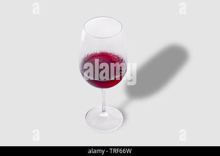 Glass of red wine on gray background Stock Photo