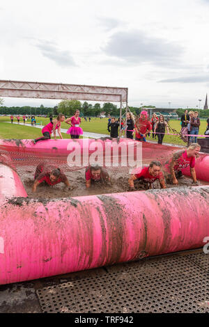 Warrington, UK. 2nd June 2019. Race for Life 2019, Warrington, in aid of Cancer Research. Runners get soaked with muddy water at the mud pit Stock Photo