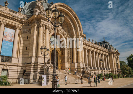 People and staircase at the golden gate of Petit Palais at Paris. One of the most impressive world’s cultural center in France. Stock Photo