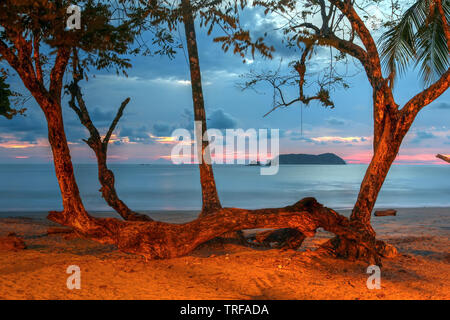 The Playa Espadilla Norte (beach), just outside the Manuel Antonio National Park in Costa Rica at sunset. Stock Photo