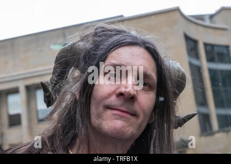 Glasgow, Scotland, UK. 4th June, 2019. A campaigner wearing horns attends the Anti-Trump Rally. Credit: Skully/Alamy Live News Stock Photo