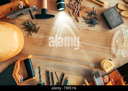 Carpenter woodwork workshop desk top view mock up with various tools around blank copy space of pine wood material Stock Photo