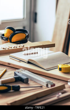 Various tools on carpentry woodwork workshop desk, selective focus with shallow depth of field Stock Photo