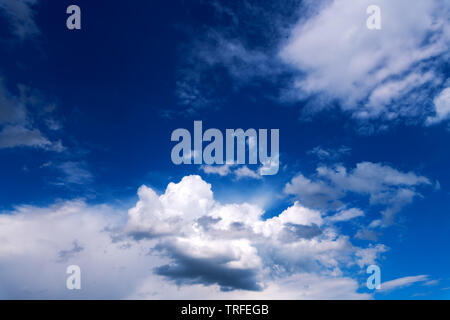Wonderful sky with clouds as background. Amazing fluffy cloudscape on blue heaven backdrop. Stock Photo