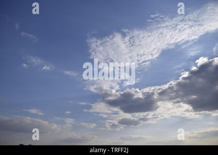 Blue sky and white clouds. Beautiful movement clouds in the sky. The formation of rain clouds. Stock Photo