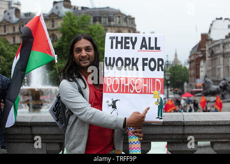 London, UK. 4th June 2019. One protester holding a placard on Trafalgar Square that all work for the Rothschild on the morning protesters holding a day of protest in central London on Trafalgar Square, Whitehall and Parliament Square against the President of the USA, Donald Trump, visiting the UK. Credit: Joe Kuis / Alamy Stock Photo