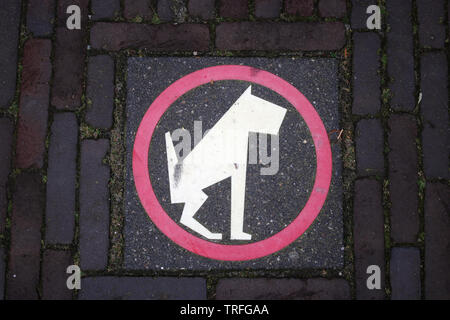 No dog fouling symbol on a paving stone on a pavement in a street in Leiden city center, Netherlands. Stock Photo