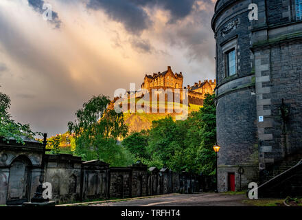 View of Edinburgh Castle from  by St Cuthbert sChrurch  in dramatic low light. Stock Photo