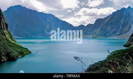 The shoreline of the lake to view the deepest lake in the Philippines at eyelevel, one is engulfed in the grand crater of the volcano. Stock Photo