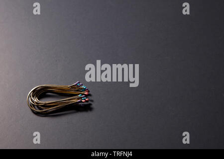 Lay flat view of horseshoe shaped metal hair pins Stock Photo