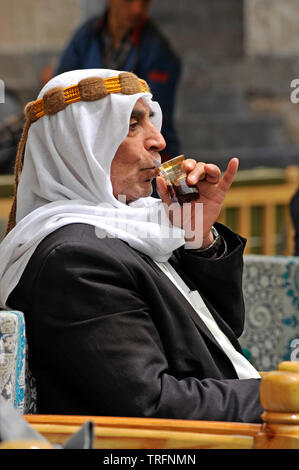 Man sipping tea in an outdoor cafe in Sanliurfa, Turkey Stock Photo