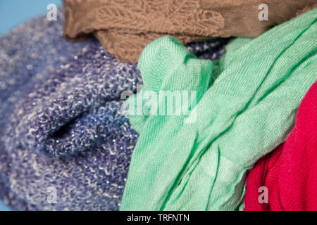 A beautiful bundle of cloth or fabric jumbled together making an interesting visual made from scarves Stock Photo