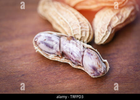 Peanut on wood background / Boiled peanuts peeled Stock Photo
