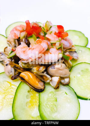 seafood salad decorated with cucumber Stock Photo