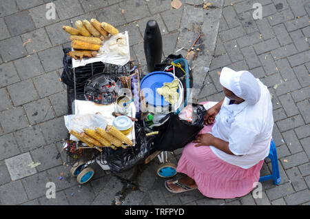 Vendor selling barbecued corn on the cob in Medellin Stock Photo